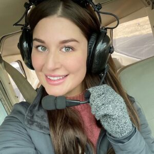 female pilot aviatrix with Dalcomm Tech pilot's headset